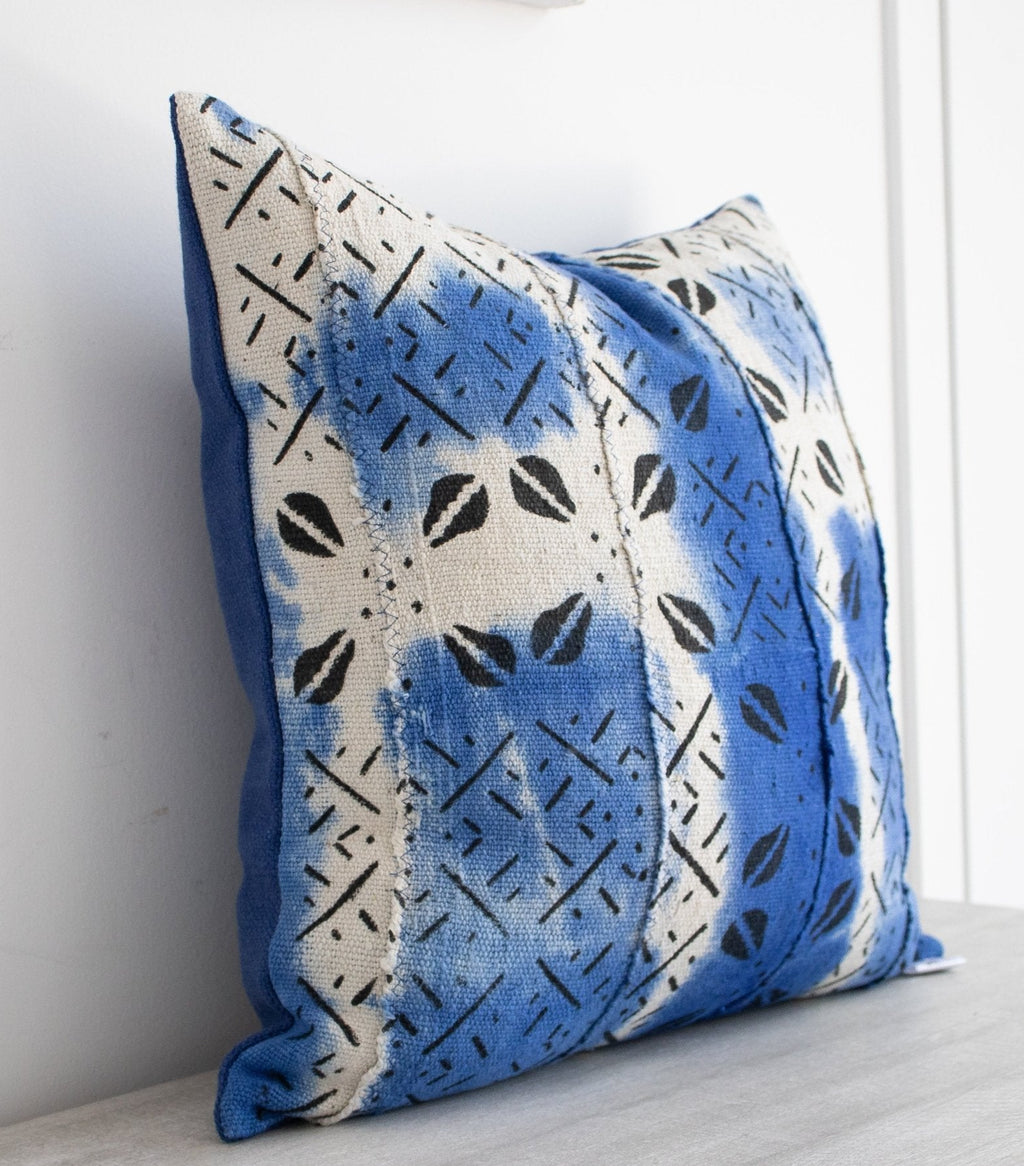 white and blue mud cloth cushion