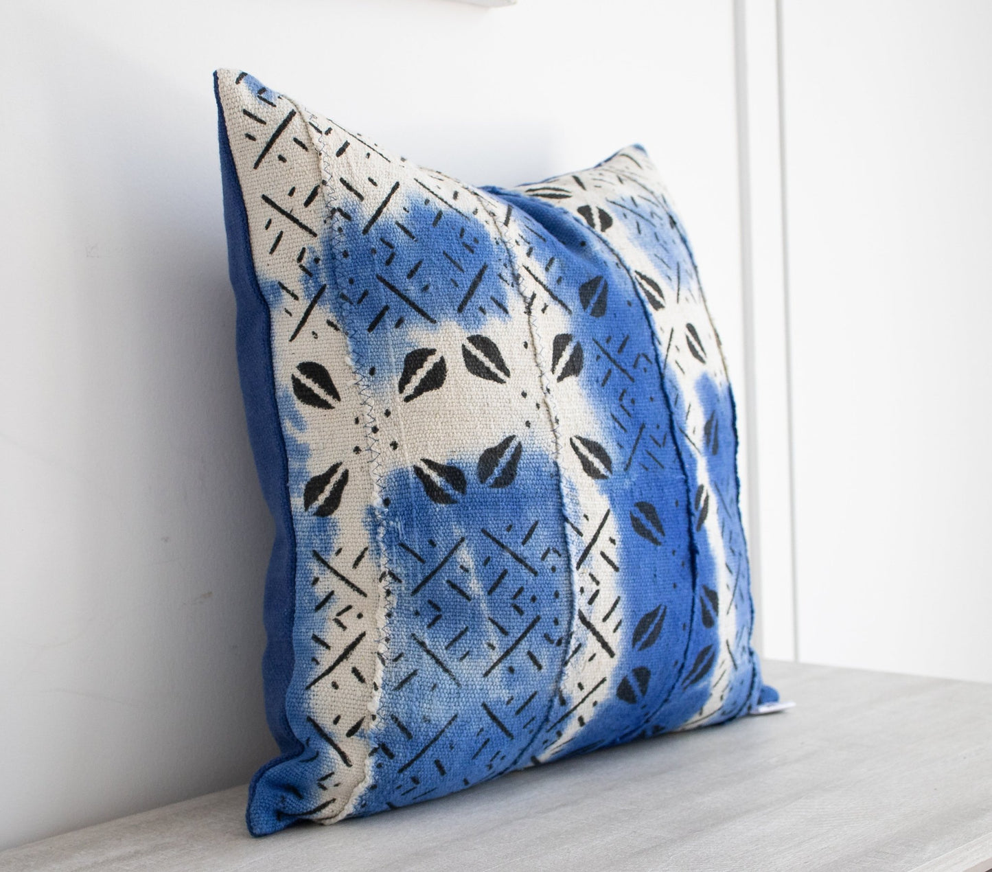 white and blue mudcloth cushion