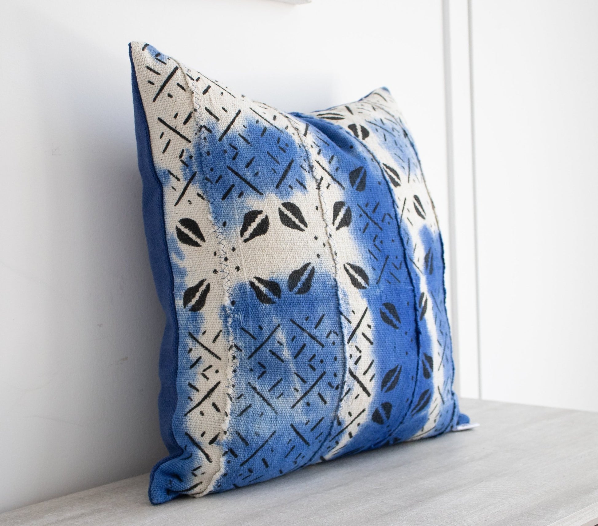 white and blue mudcloth cushion