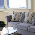 white couch mudcloth cushion 